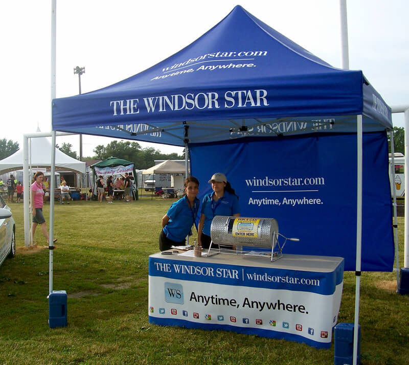 custom tent with with banner and table display
